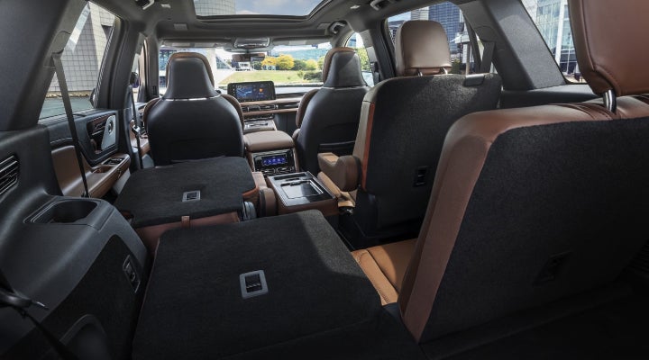 One side of the PowerFold® third-row seat and a second-row seat are folded forward in the 2026 Lincoln Aviator® SUV. | Mike Carpino Lincoln in Pittsburg KS