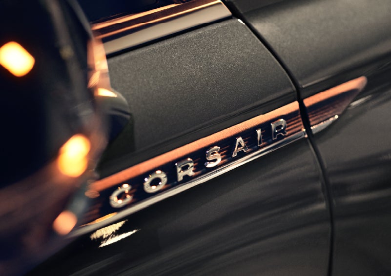 A 2026 Lincoln Corsair® SUV is shown being driven on a country road. | Mike Carpino Lincoln in Pittsburg KS