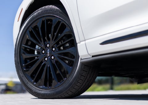 A stylish 20-inch black aluminum wheel of the available Jet Appearance Package is shown. | Mike Carpino Lincoln in Pittsburg KS