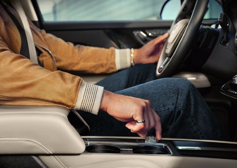 The driver of a 2026 Lincoln Corsair® SUV is shown selecting a drive mode. | Mike Carpino Lincoln in Pittsburg KS