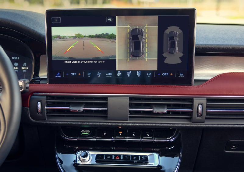A couple approaches a 2026 Lincoln Corsair® Reserve model as the Lincoln Embrace illumination guides the way | Mike Carpino Lincoln in Pittsburg KS