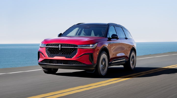 A 2026 Lincoln Nautilus® SUV is being driven on a seaside roadway. | Mike Carpino Lincoln in Pittsburg KS