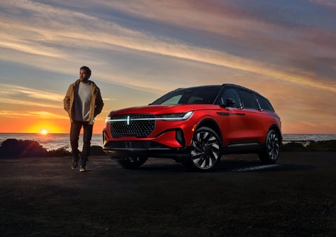 A person is shown next to a 2026 Lincoln Nautilus® SUV as the Lincoln Embrace sequence takes place. | Mike Carpino Lincoln in Pittsburg KS