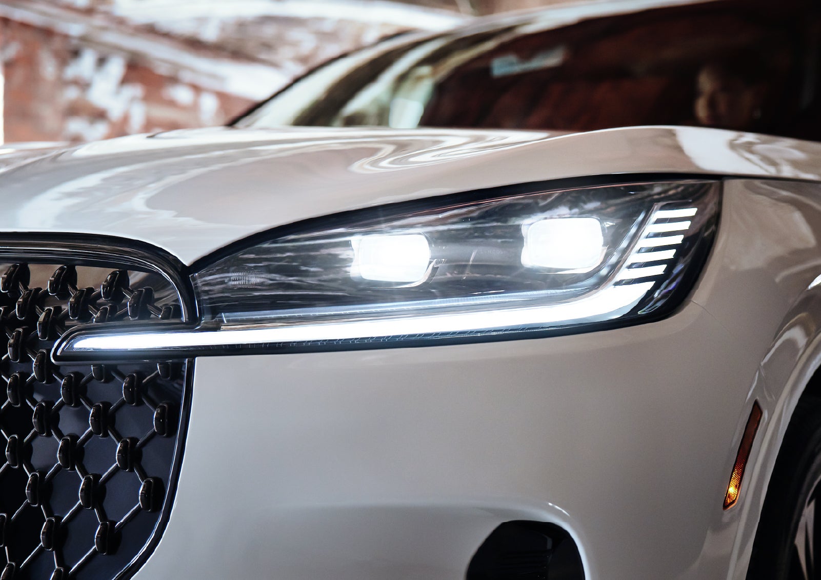 A close-up of a headlamp on the 2027 Lincoln Aviator® SUV is shown. | Mike Carpino Lincoln in Pittsburg KS