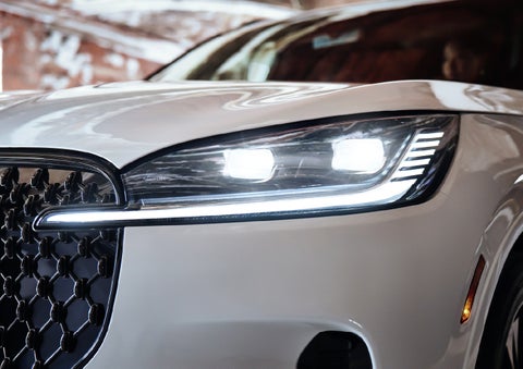 A close-up of a headlamp on the 2027 Lincoln Aviator® SUV is shown. | Mike Carpino Lincoln in Pittsburg KS