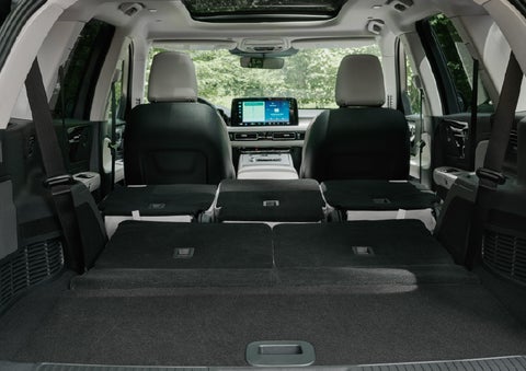 A rear to front view of the interior of a 2027 Lincoln Aviator® Black Label™ SUV shows the third and second rows folded flat | Mike Carpino Lincoln in Pittsburg KS